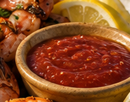 Shrimp with cocktail sauce and lemon